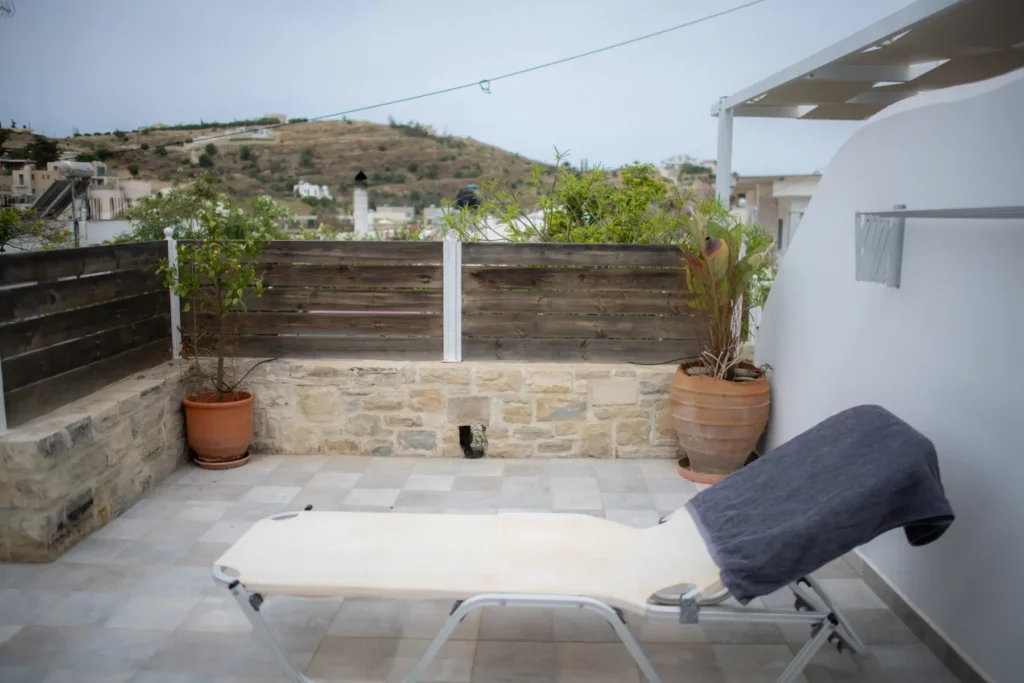 A sunbed in the courtyard, with a view over the village