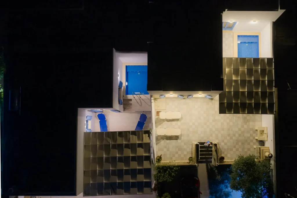 The courtyards from above at night, with both jacuzzis lit