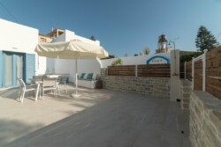 The side of the yard, with the outside shower The side of the yard, with the outside shower