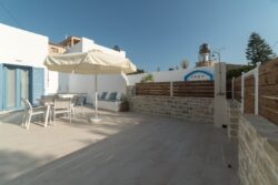 The side of the yard, with the outside shower The side of the yard, with the outside shower